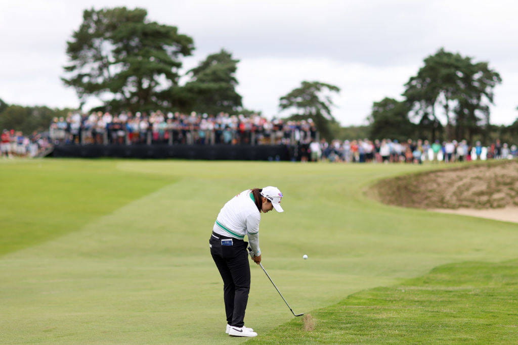 Hye-Jin Choi plays an iron shot out of the first cut of rough at Walton Heath